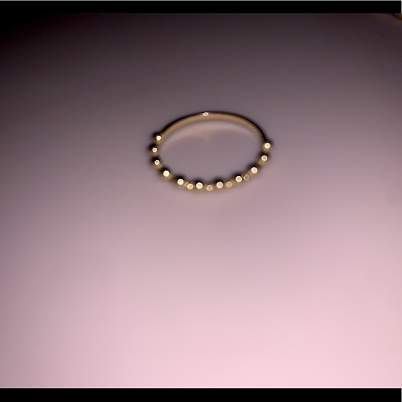 Woman’s gold ring.